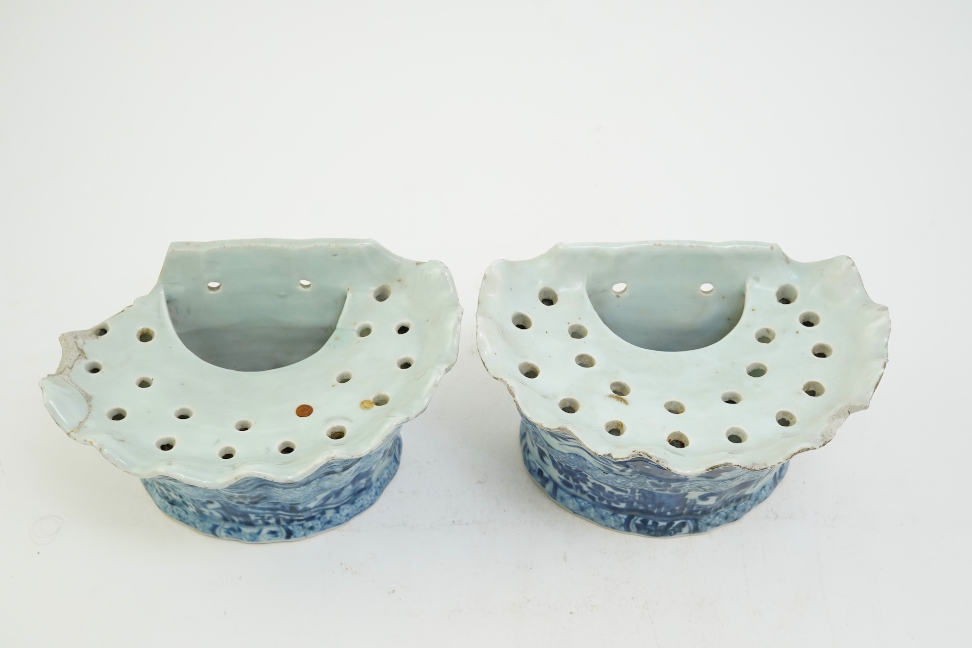 A pair of unusual Chinese export blue and white bough pots, after a Delft model, Qianlong period